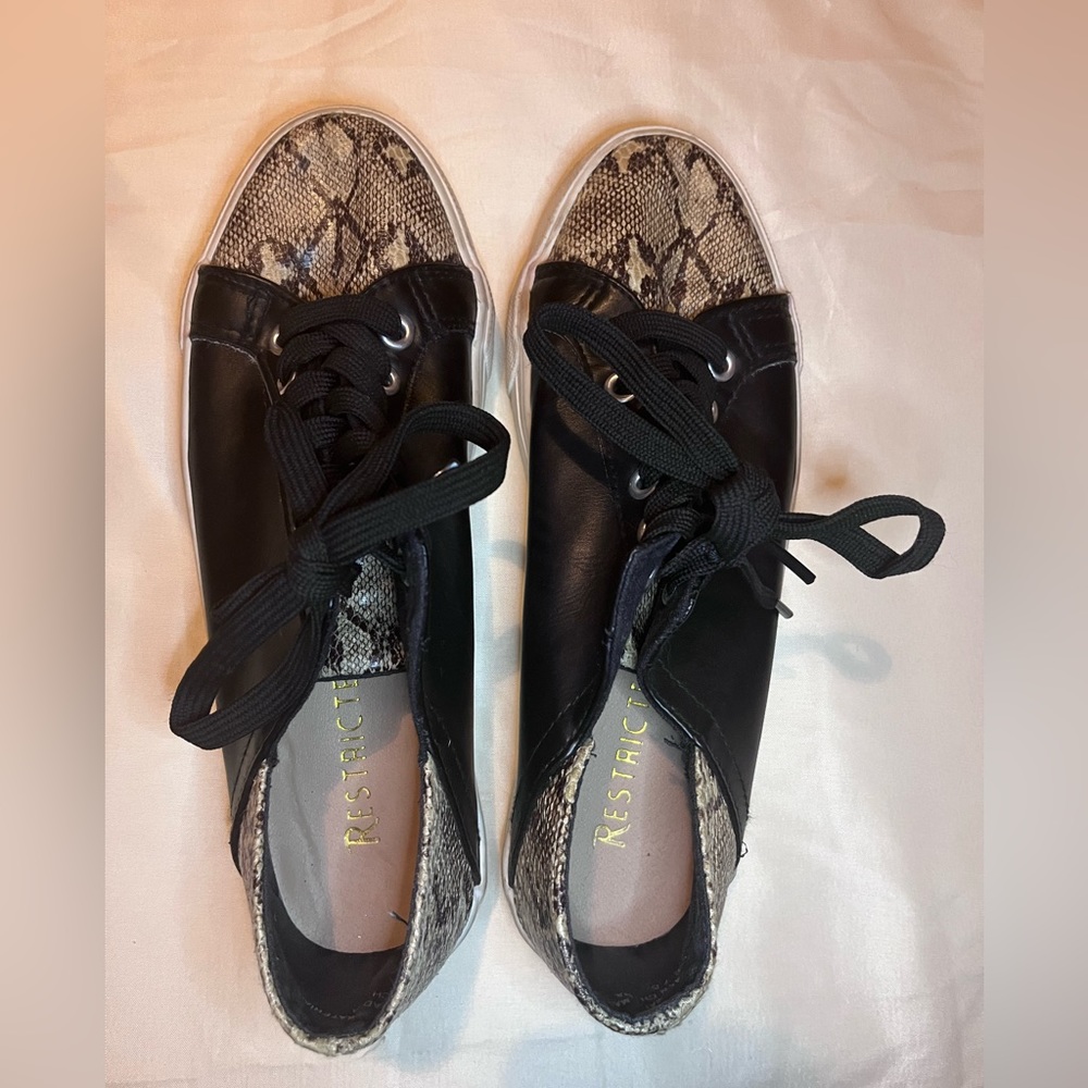 Snakeskin and black sneakers